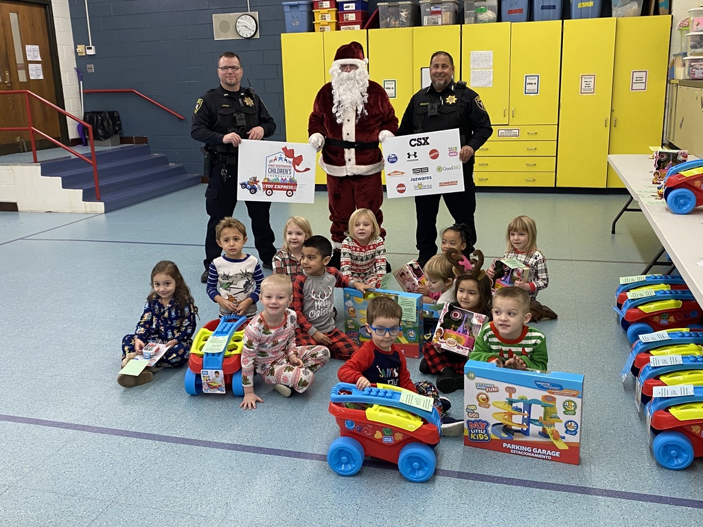 Momence Police with Pre-K students and their donated gifts.