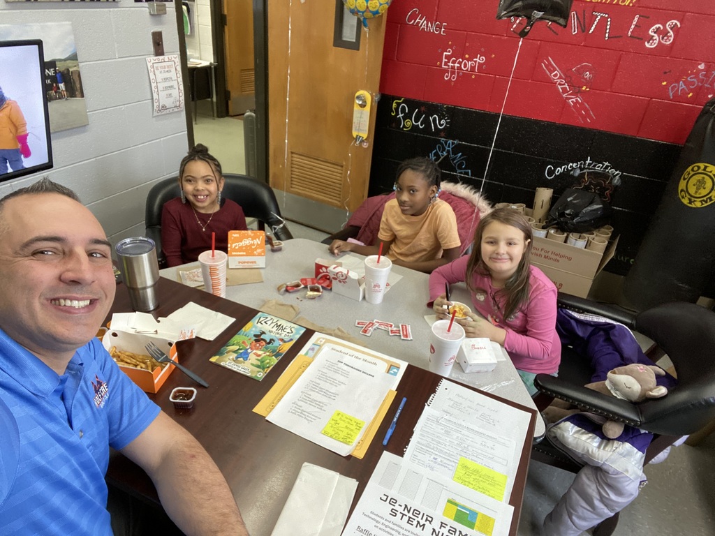 Mr. Piper and three students enjoying lunch